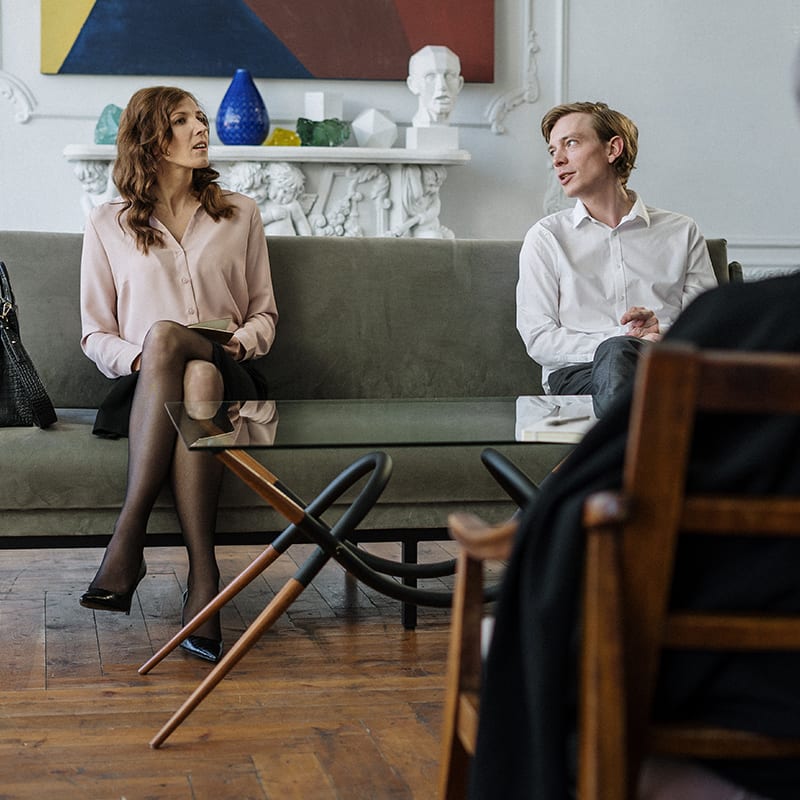 couple discussing with lawyer